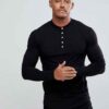 Close-up of navy golf polo shirt showing fine pique knit texture, crisp collar stitching, and subtle tailored fit. Ideal for