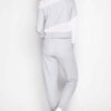 Grey mesh sweatsuit for women: textured athletic fabric, breathable weave, tailored fit. Custom wholesale options available.