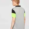 Close-up of a premium cotton polo shirt, textured fabric, clean stitching. Breathable men's wear, available in various colors