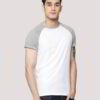 Close-up on a smooth, finely-knitted t-shirt. Notice the tight stitching and soft drape, hints of premium cotton in solid col