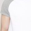 Close-up on a smooth, finely-knitted t-shirt. Notice the tight stitching and soft drape, hints of premium cotton in solid col