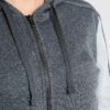 Crimson and charcoal football training tracksuit. Close-up shows breathable fabric, reinforced stitching. Jacket and pants se