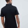 Close-up of custom polo: vibrant blue cotton, crisp embroidered design, fine stitching. Soft, breathable fabric visible. - Vi