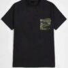 Men's camo t-shirt. Close up shows durable patch pockets, quality stitching. Soft, breathable feel implied by the fabric text