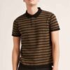 Close-up: premium polo shirts in soft, breathable fabric. Fine stitching, subtly textured. Ideal corporate apparel in various