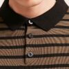 Close-up: premium polo shirts in soft, breathable fabric. Fine stitching, subtly textured. Ideal corporate apparel in various