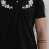 Close-up of a well-stitched polo shirt. Notice the soft pique knit fabric, short sleeves and neat button placket. Ideal for b