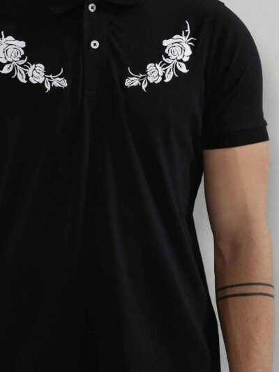 Close-up of a well-stitched polo shirt. Notice the soft pique knit fabric, short sleeves and neat button placket. Ideal for b