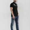 Close-up of a well-stitched polo shirt. Notice the soft pique knit fabric, short sleeves and neat button placket. Ideal for b