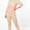 Women's hooded tracksuit, soft brushed fleece texture, custom stitching detail. Adjustable drawstring hood, relaxed fit. Note