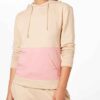 Women's hooded tracksuit, soft brushed fleece texture, custom stitching detail. Adjustable drawstring hood, relaxed fit. Note
