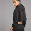 Black women's sweatsuit. Soft fleece knit, ribbed cuffs & waistband. Relaxed fit, drawstring hoodie, visible topstitching. Co