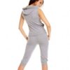 Form-fitting women's sweatsuit featuring a front zipper closure. Soft fabric with visible stitching details. Hints of a bold
