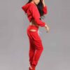 Red-hot ladies sweatsuit featuring a cropped top. Soft, textured fabric with visible stitching. Perfect for casual style and