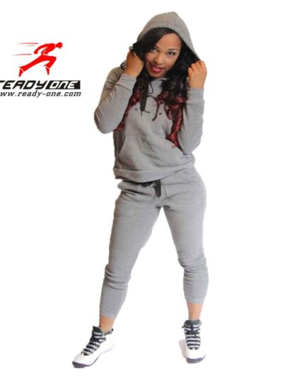 Fitted ladies' sweatsuit in soft heather grey. Skinny leg cut, ribbed cuffs and waistband, subtle topstitching detail visible
