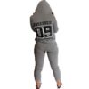 Fitted ladies' sweatsuit in soft heather grey. Skinny leg cut, ribbed cuffs and waistband, subtle topstitching detail visible