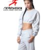 Cozy ladies' sweatsuit in heather gray. Close-up shows soft fleece texture, durable stitching. Cropped hoodie, relaxed fit jo