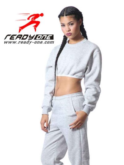 Cozy ladies' sweatsuit in heather gray. Close-up shows soft fleece texture, durable stitching. Cropped hoodie, relaxed fit jo