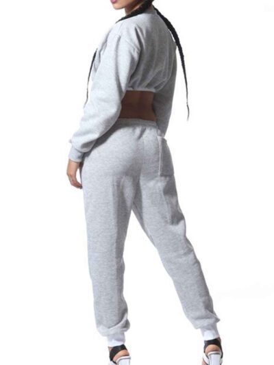 Cozy ladies' sweatsuit in heather gray. Close-up shows soft fleece texture, durable stitching. Cropped hoodie, relaxed fit jo