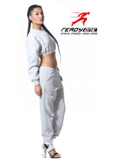 Cozy ladies' sweatsuit in heather gray. Close-up shows soft fleece texture, durable stitching. Cropped hoodie, relaxed fit jo
