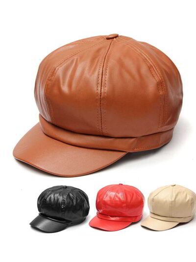 Close-up of a stylish snapback cap featuring a rich leather patch. Notice the textured fabric, intricate stitching, and class
