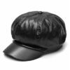 Close-up of a stylish snapback cap featuring a rich leather patch. Notice the textured fabric, intricate stitching, and class
