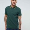 Close-up of a lightweight polo shirt, likely polyester knit. Bright, fully sublimated design with fine stitching visible at t