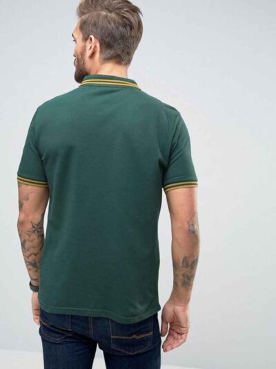 Close-up of a lightweight polo shirt, likely polyester knit. Bright, fully sublimated design with fine stitching visible at t