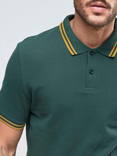 Close-up of a lightweight polo shirt, likely polyester knit. Bright, fully sublimated design with fine stitching visible at t