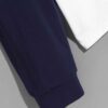 Color block polo shirt with long sleeves. Notice soft cotton-poly blend texture and clean, sturdy stitching. Athletic wear. -