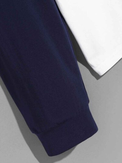 Color block polo shirt with long sleeves. Notice soft cotton-poly blend texture and clean, sturdy stitching. Athletic wear. -