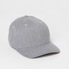 Grey men's cap with subtle textured fabric. Curved brim, clean stitching. Adjustable back closure. Casual, understated style.