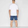Men's gym set: breathable athletic shorts and fitted tee. Notice fine stitching, soft-touch fabric, and subtle color gradient