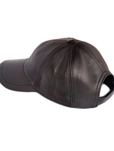 Supple black leather cadet cape, showcasing fine stitching and a relaxed drape. Collar detail prominent. Luxurious texture an