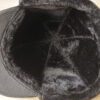 Leather driving cap with plush fleece lining. Warm winter hat, flat style, ear flaps. Fine stitching detail visible on smooth