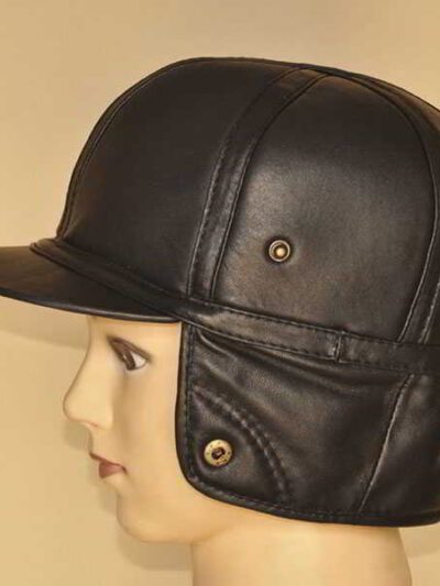 Leather driving cap with plush fleece lining. Warm winter hat, flat style, ear flaps. Fine stitching detail visible on smooth