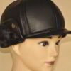 Leather driving cap with plush fleece lining. Warm winter hat, flat style, ear flaps. Fine stitching detail visible on smooth