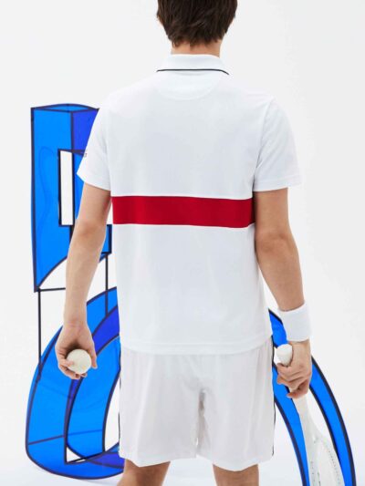 Men's sports polo shirt featuring colorful blocks design and custom embroidered logo. Fabric has a soft, breathable texture w