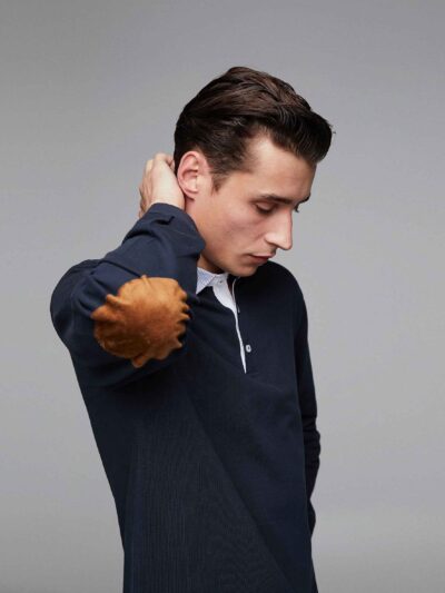 Men's polo shirt, classic fit, light blue pique knit fabric. Notice the neat collar stitching and short sleeves. Soft texture