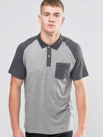 Men's slim fit polo shirt, fine knit texture, pique weave, crisp collar, button placket. Subtle heather grey hints. Professio