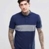 Close-up: Navy blue men's polo shirt. Soft pique knit texture, clean stitching. Classic short sleeves, subtle collar, custom
