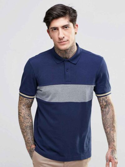 Close-up: Navy blue men's polo shirt. Soft pique knit texture, clean stitching. Classic short sleeves, subtle collar, custom