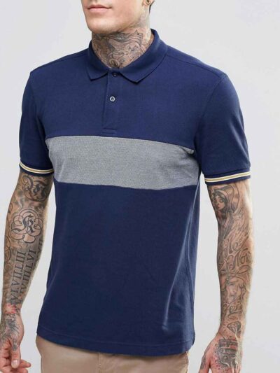 Close-up: Navy blue men's polo shirt. Soft pique knit texture, clean stitching. Classic short sleeves, subtle collar, custom