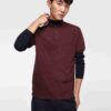 Close-up of a cotton polo shirt, showcasing fine pique knit texture and clean stitching. Casual top with subtle color variati