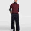 Close-up of a cotton polo shirt, showcasing fine pique knit texture and clean stitching. Casual top with subtle color variati