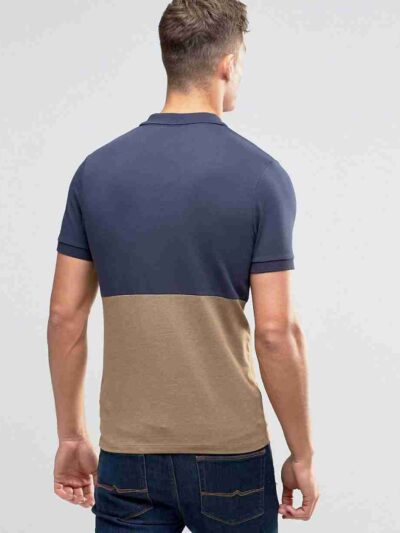 Close-up of a textured pique polo shirt. Notice the quality stitching, custom logo, and button placket. Light blue hue, breat