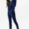 Navy velour loungewear set. Pullover hoodie with matching bottoms. Soft, plush texture with subtle sheen. Clean stitching, re