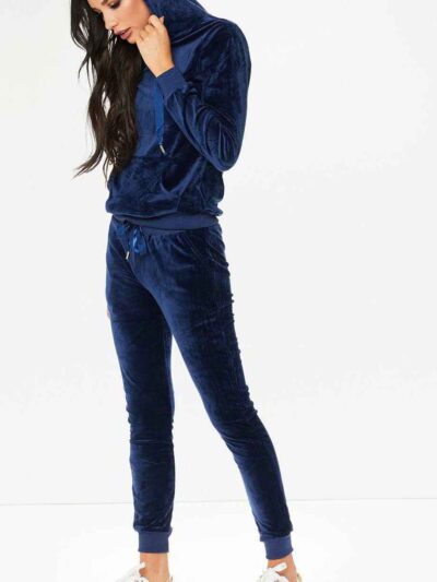 Navy velour loungewear set. Pullover hoodie with matching bottoms. Soft, plush texture with subtle sheen. Clean stitching, re