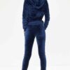 Navy velour loungewear set. Pullover hoodie with matching bottoms. Soft, plush texture with subtle sheen. Clean stitching, re