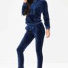 Navy velour loungewear set. Pullover hoodie with matching bottoms. Soft, plush texture with subtle sheen. Clean stitching, re